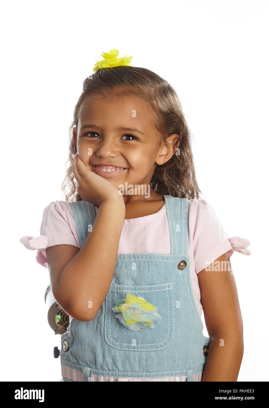 little girl in overalls Stock Photo Alamy