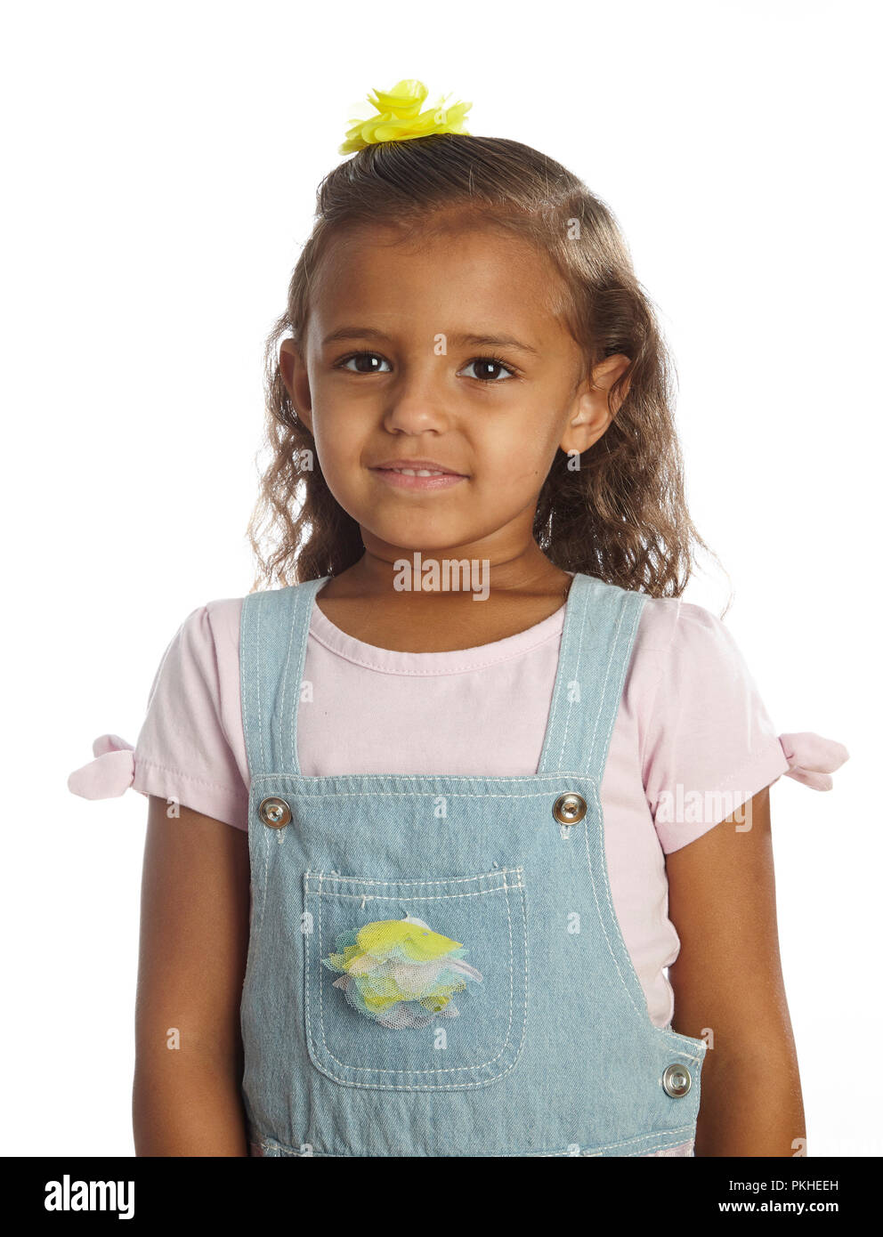little girl in overalls Stock Photo Alamy