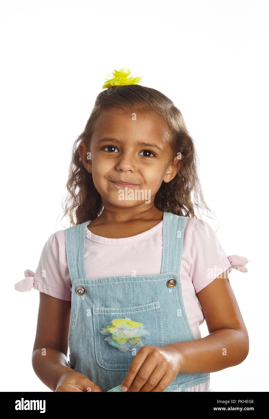 little girl in overalls Stock Photo Alamy