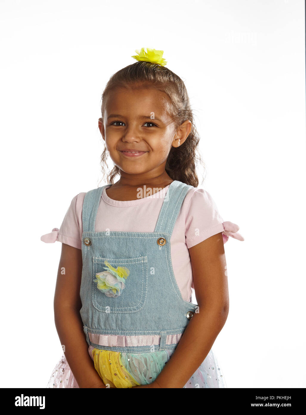 little girl in overalls Stock Photo
