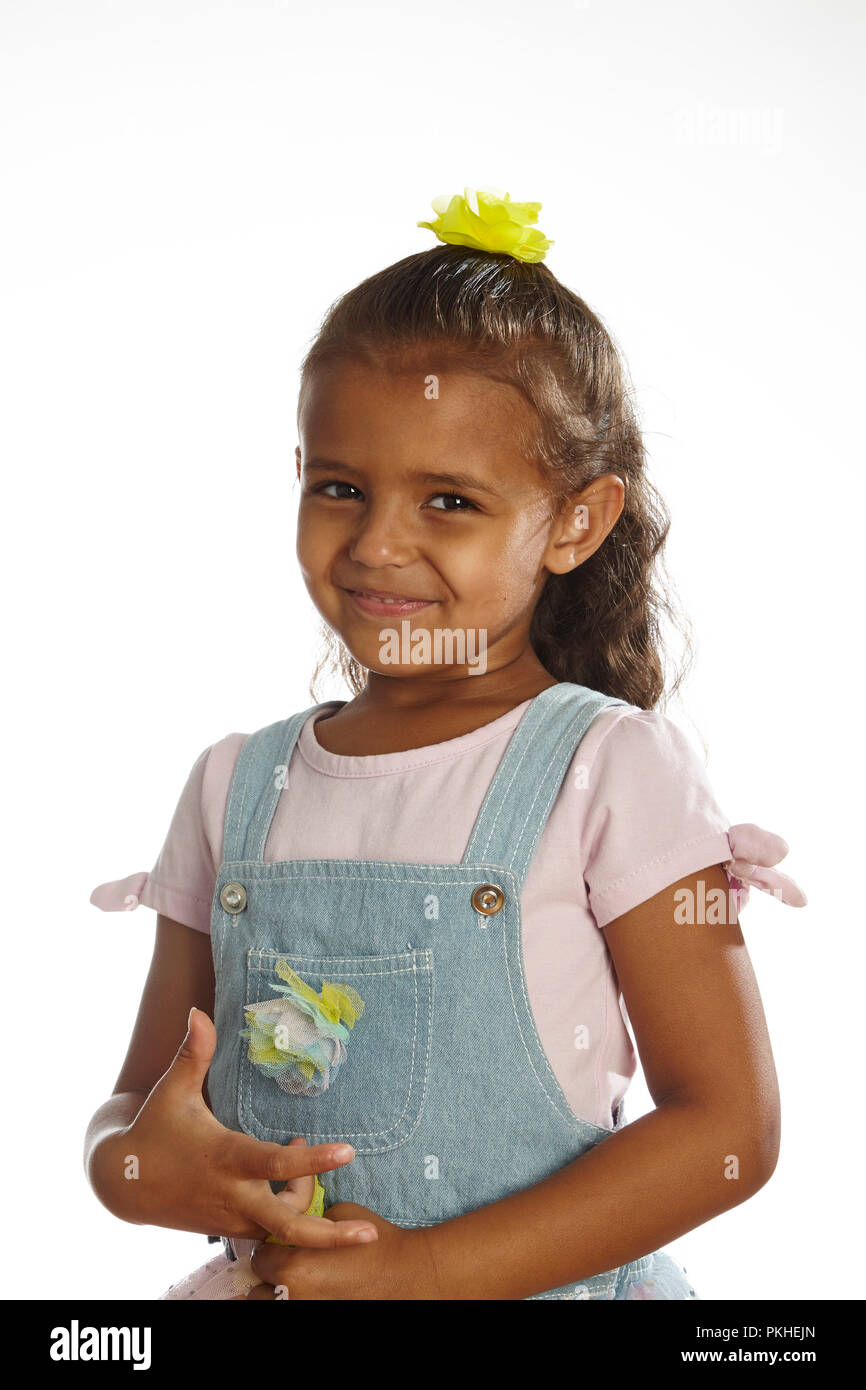 little girl in overalls Stock Photo Alamy