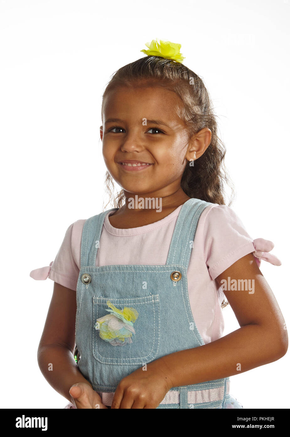 little girl in overalls Stock Photo Alamy