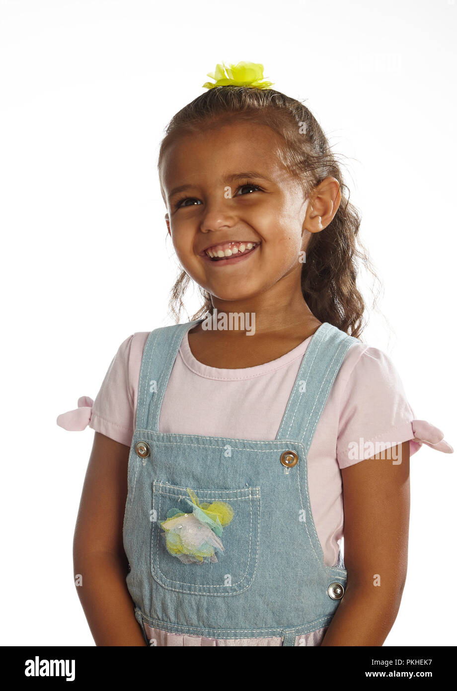 little girl in overalls Stock Photo Alamy