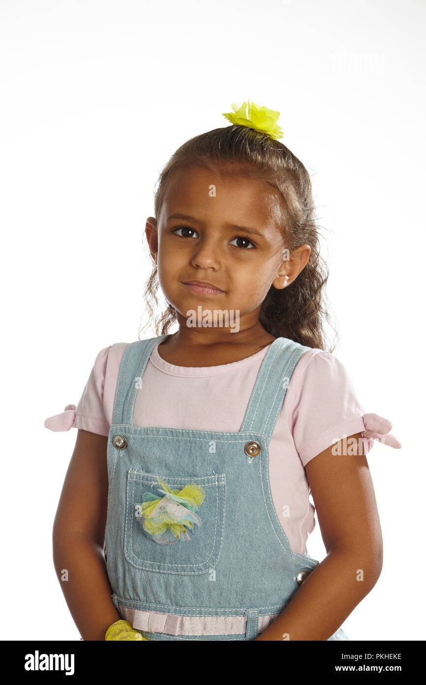 little girl in overalls Stock Photo Alamy