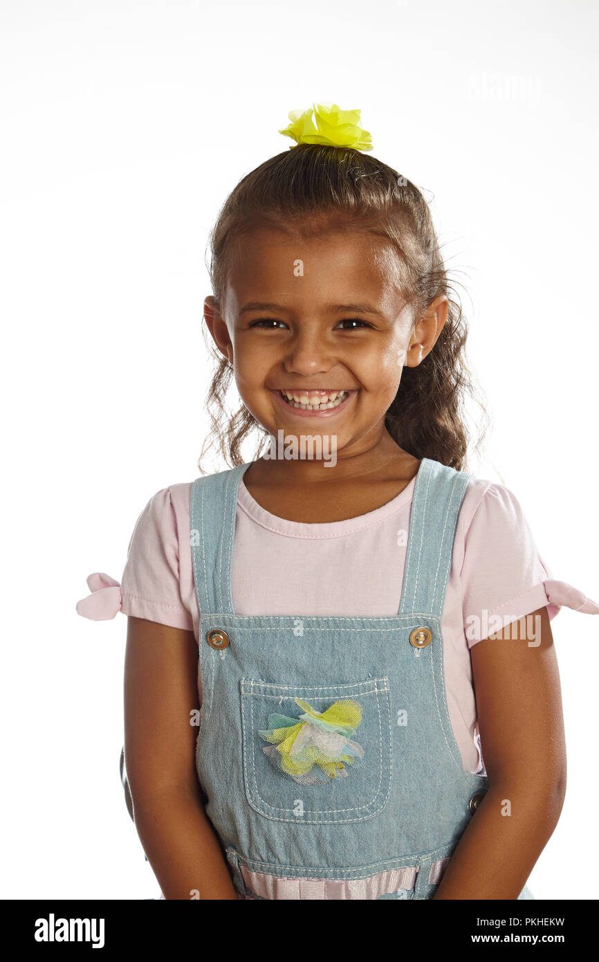 little girl in overalls Stock Photo