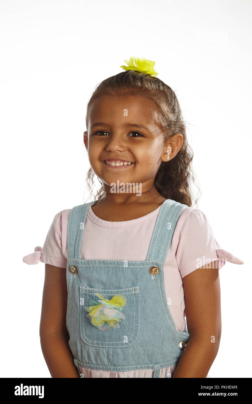 little girl in overalls Stock Photo Alamy