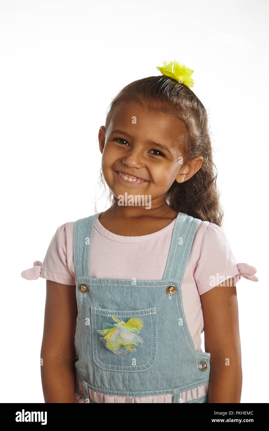 little girl in overalls Stock Photo