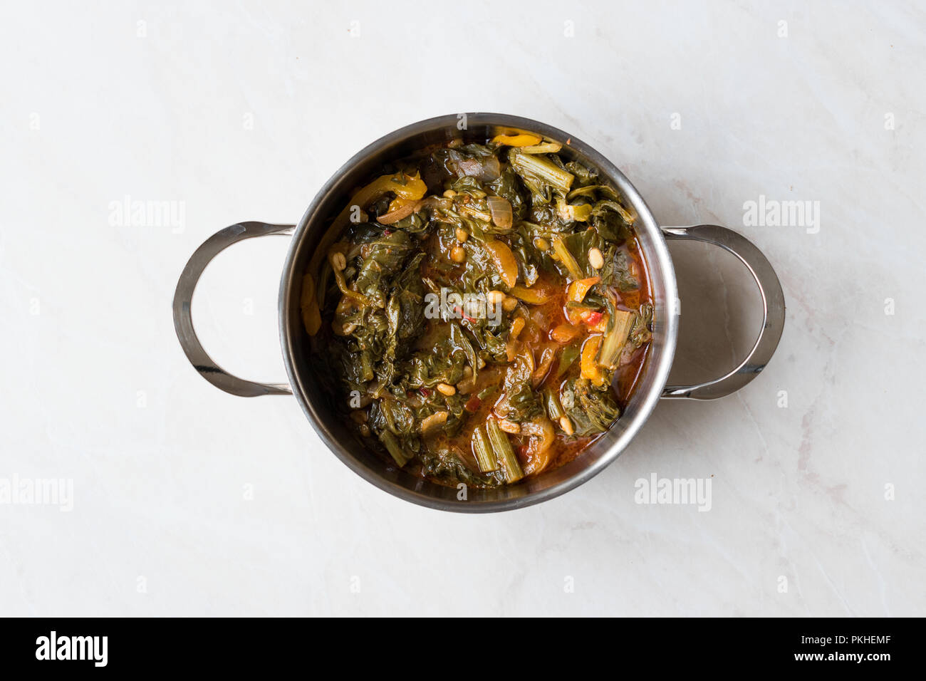 Homemade Healthy Chard with Rice, Onions and Tomato Paste in Metal Pot