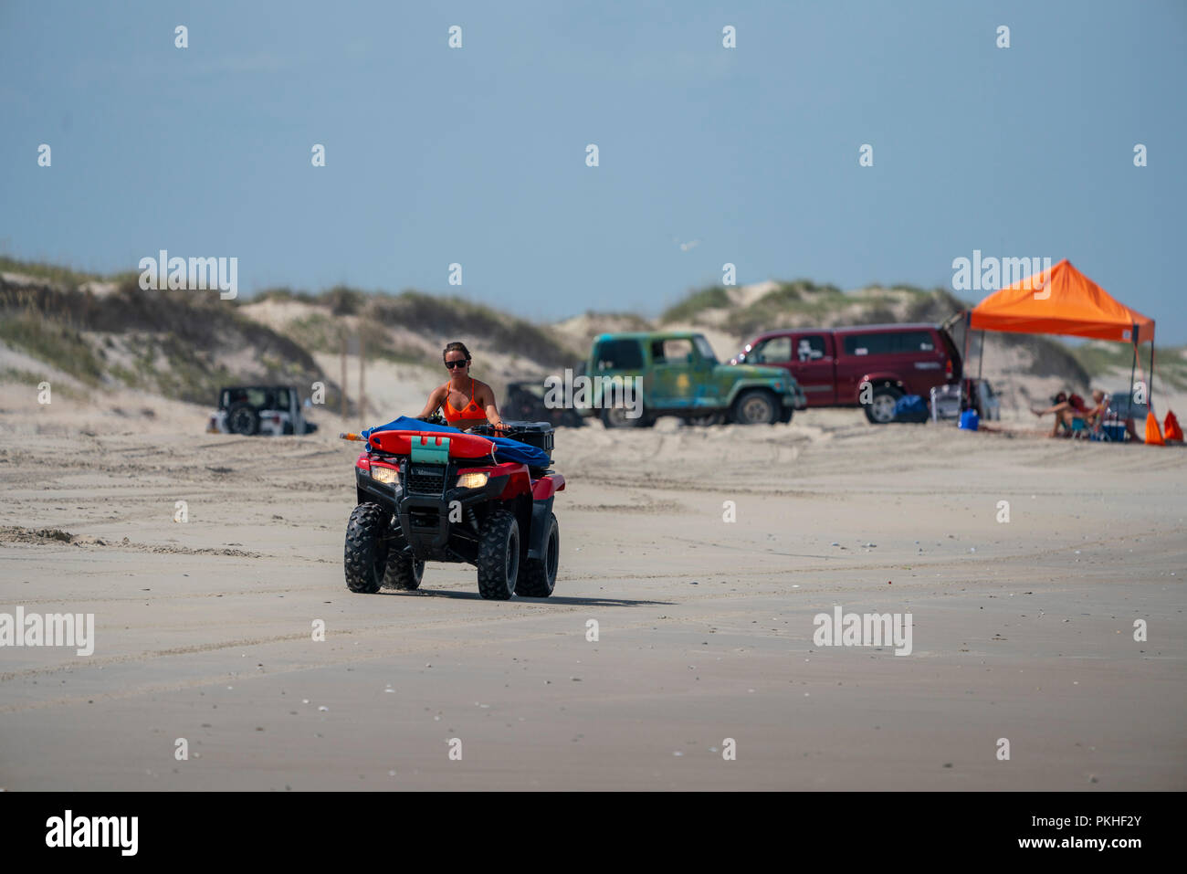 Lifeguard drives a ATV on the beach in Carova 4x4 section of beach in