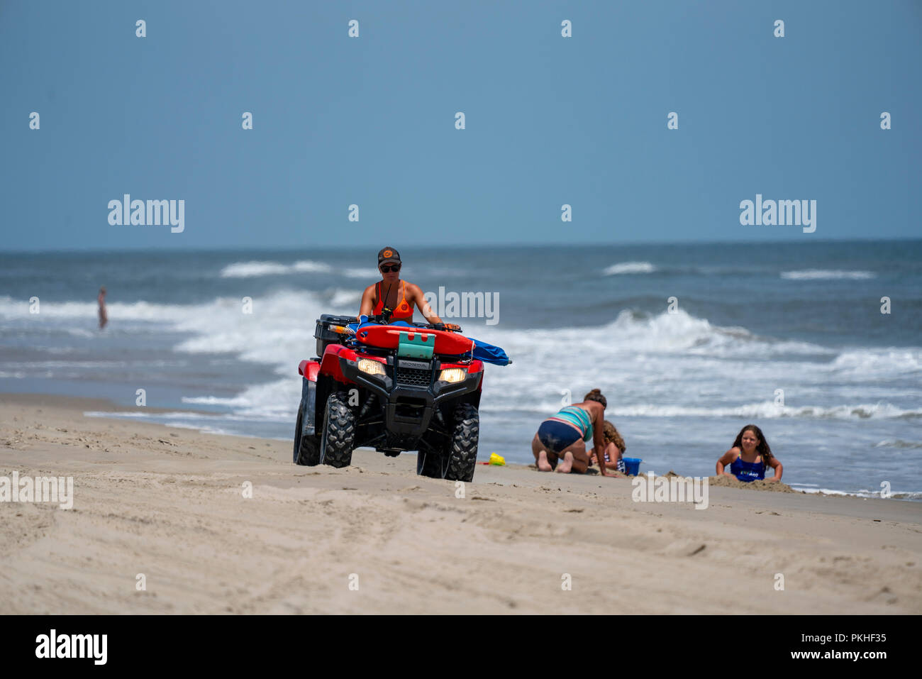 Lifeguard drives a ATV on the beach in Carova 4x4 section of beach in