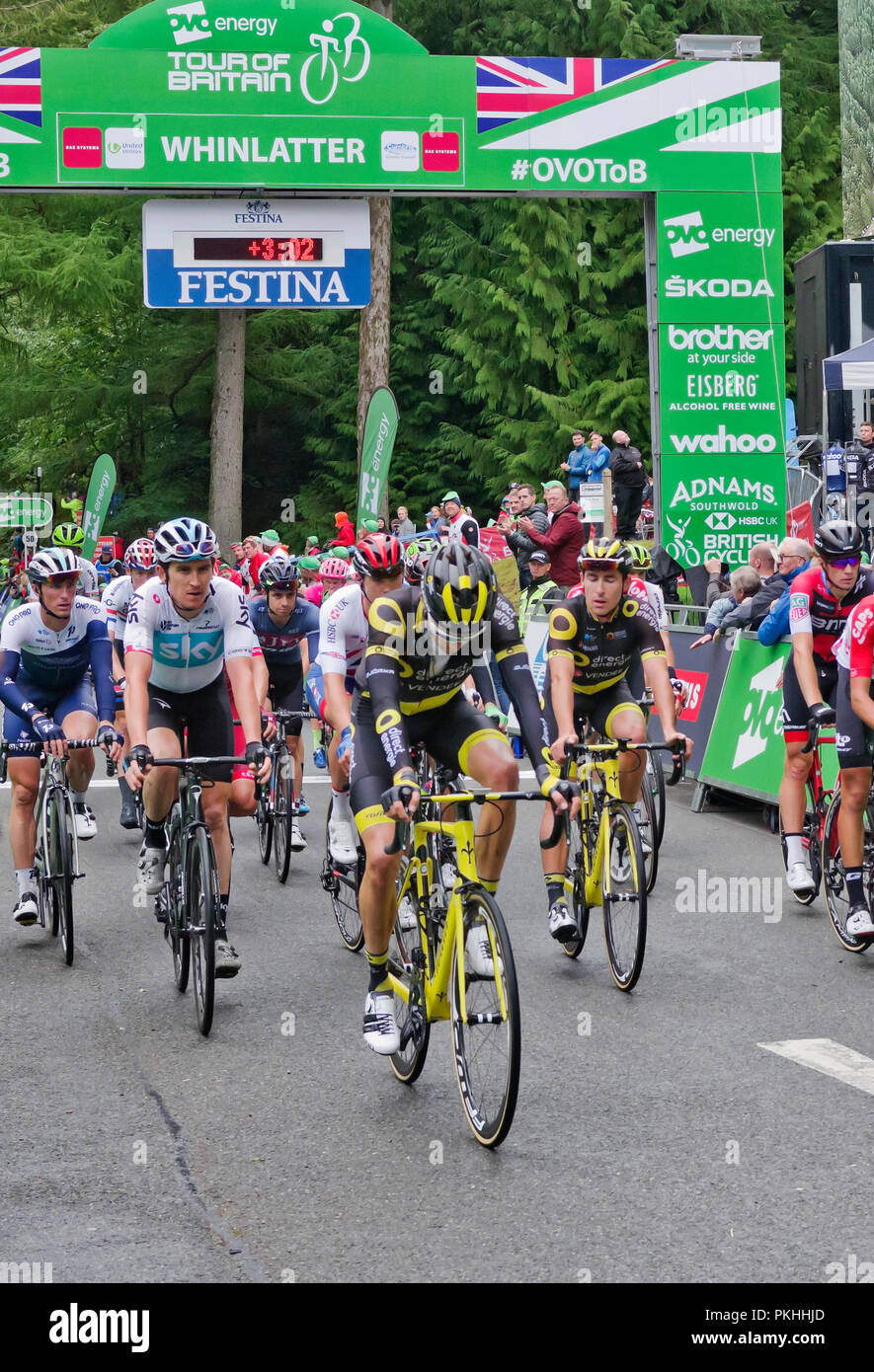 Tour of Britain 2018. Tour de France winner Geraint Thomas (on left), riding for Team Sky crosses finish line of Stage 6 at Whinlatter Visitor Centre. Stock Photo