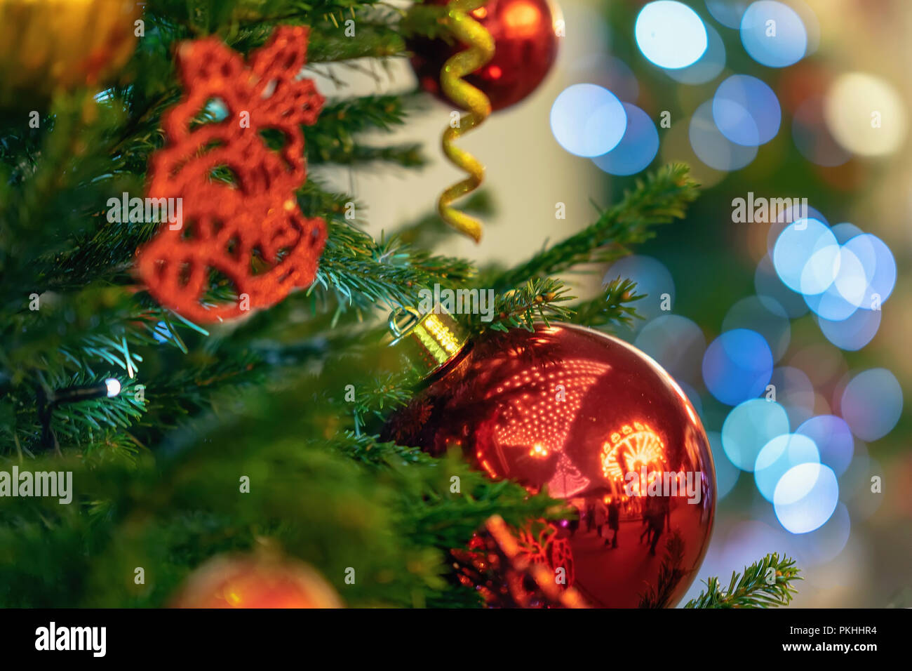 Christmas tree with decorations, christmas balls, light garlands, bokeh ...