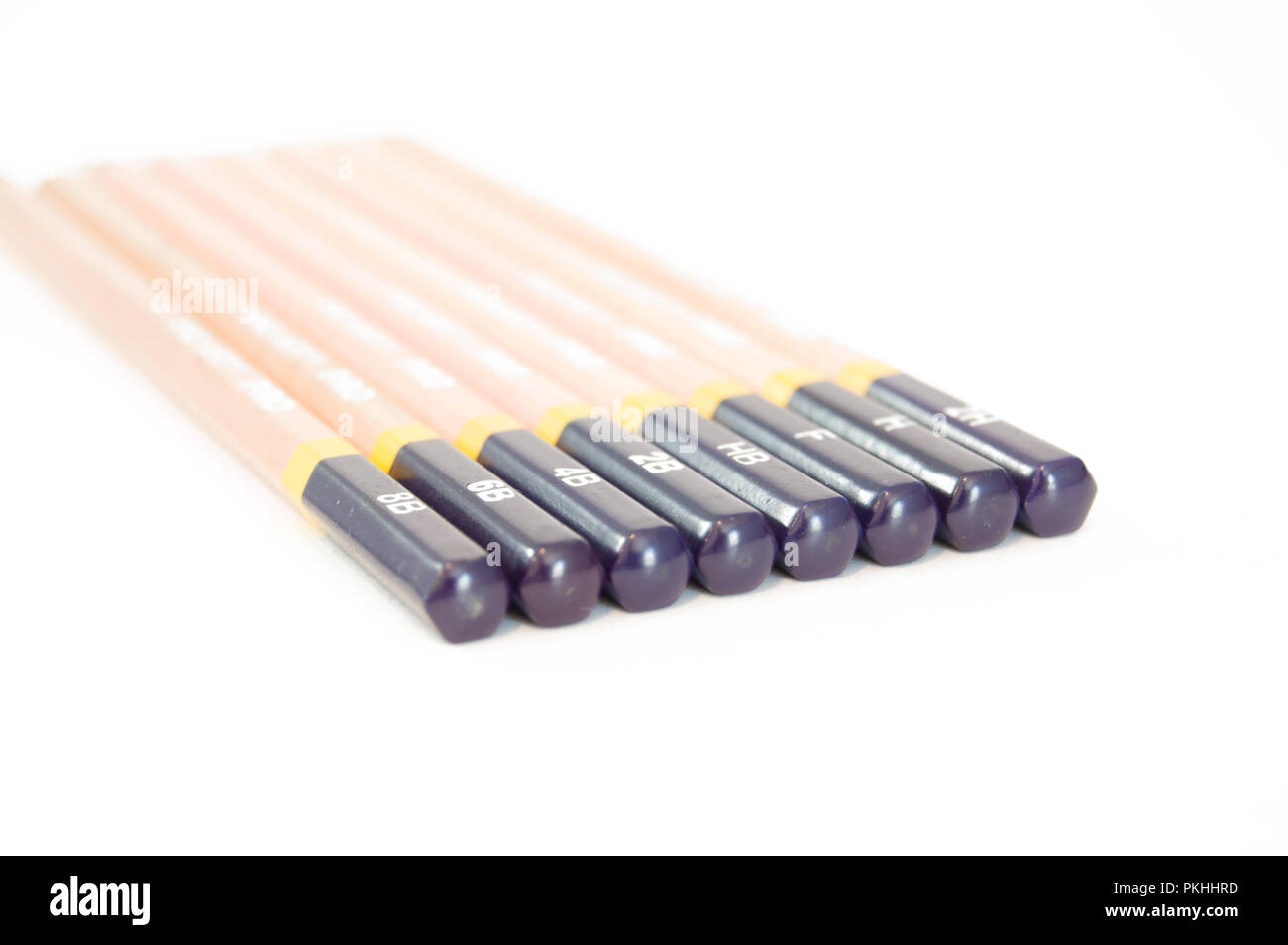 A set of drawing pencils from overhead on a white background. Stock Photo