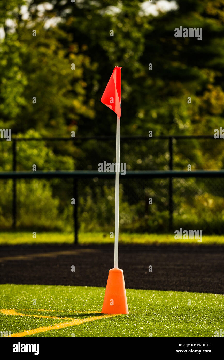 corner flag on a turf soccer field lit with afternoon light Stock Photo