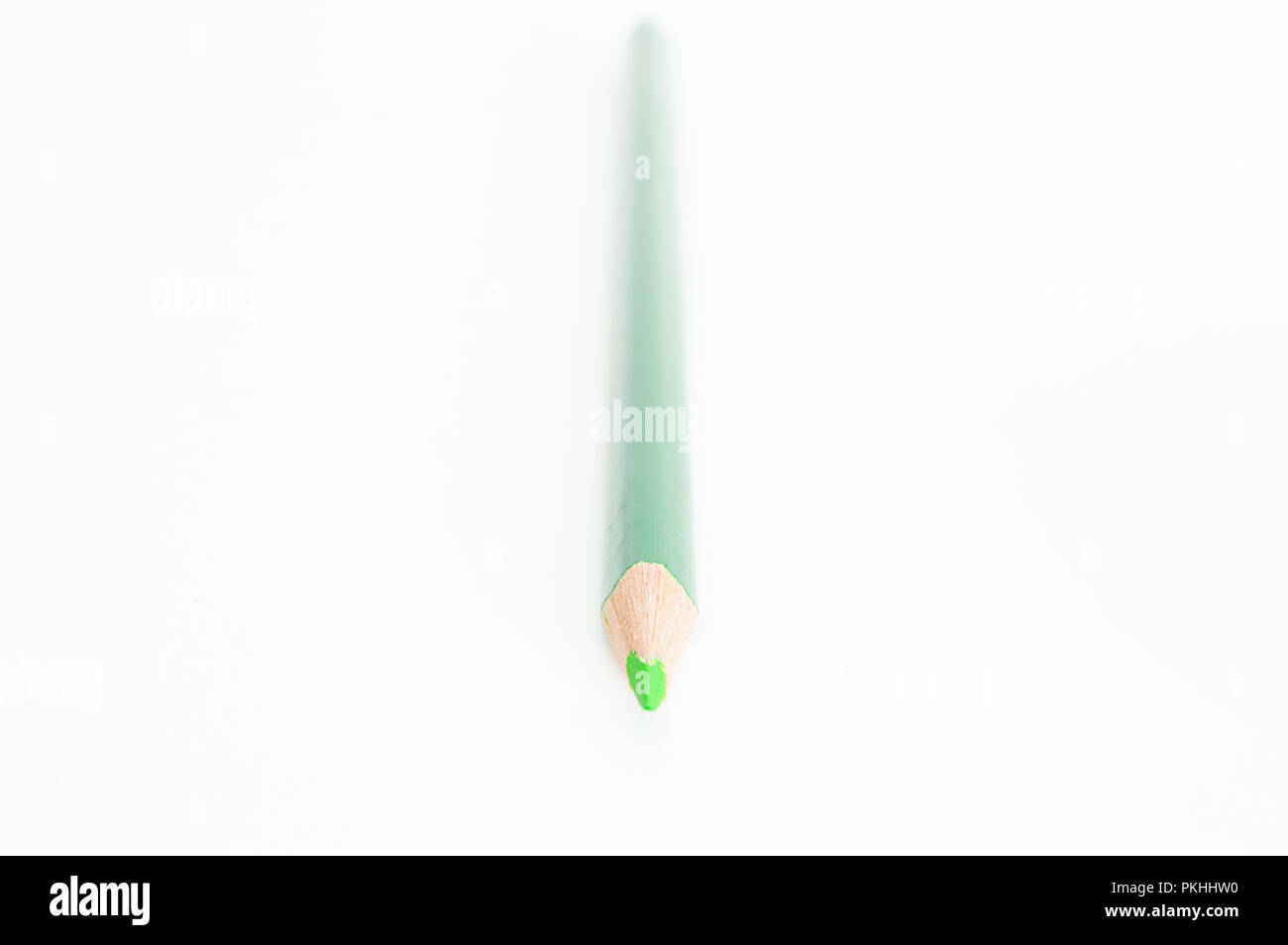 An isolated light green colored pencil on a white background Stock
