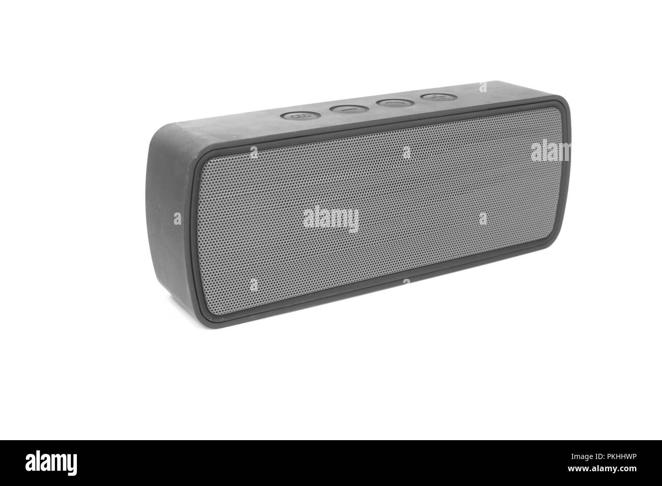An isolated bluetooth speaker angled on a white background. Stock Photo