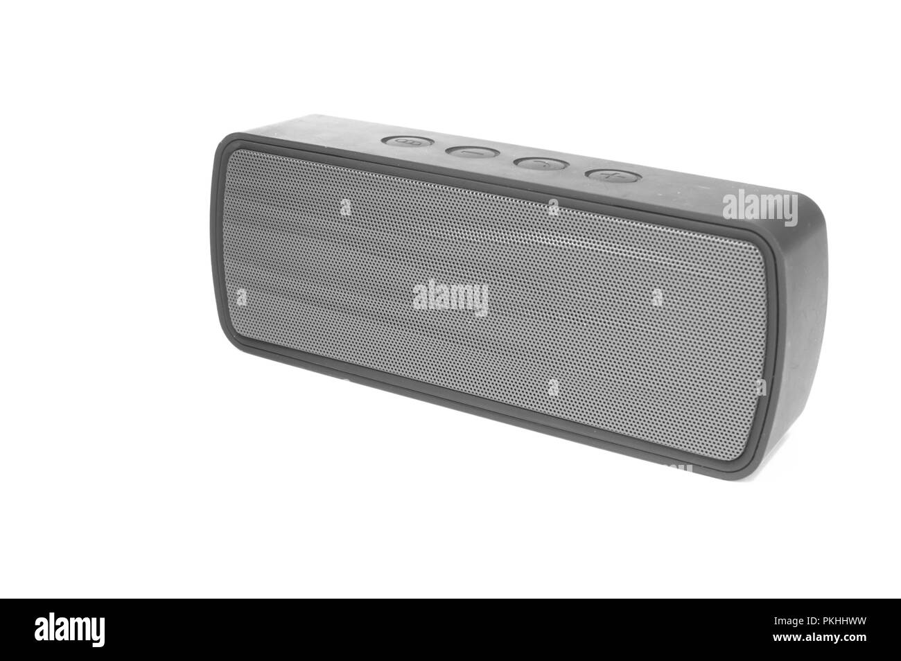 An isolated bluetooth speaker angled on a white background. Stock Photo
