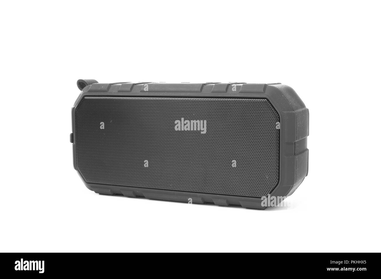 An isolated bluetooth speaker angled on a white background. Stock Photo