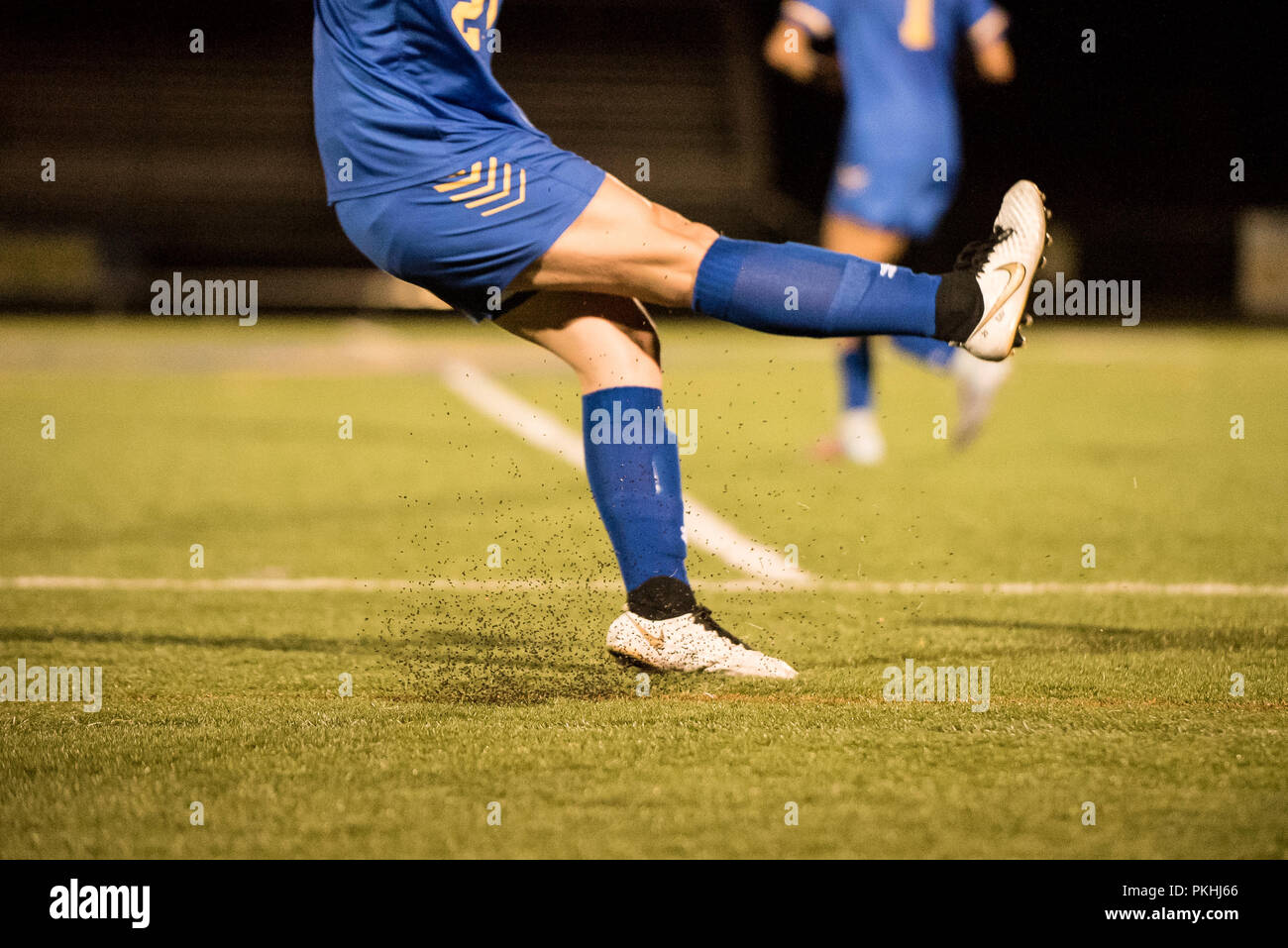 Underkick penalty soccer kick taken under the lights Stock Photo - Alamy