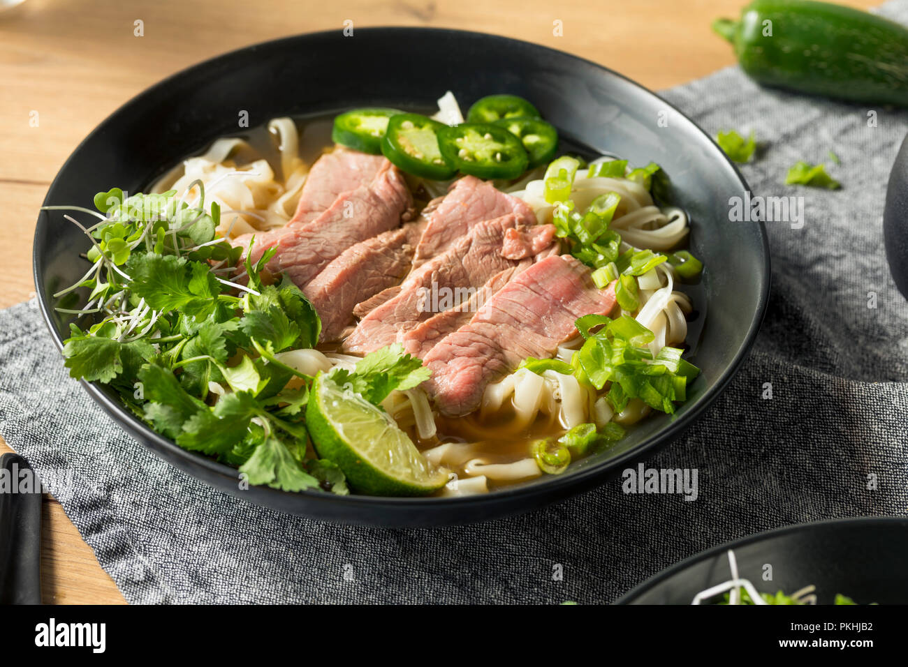 Homemade Beef Vietnamese Pho Soup with Veggies Stock Photo