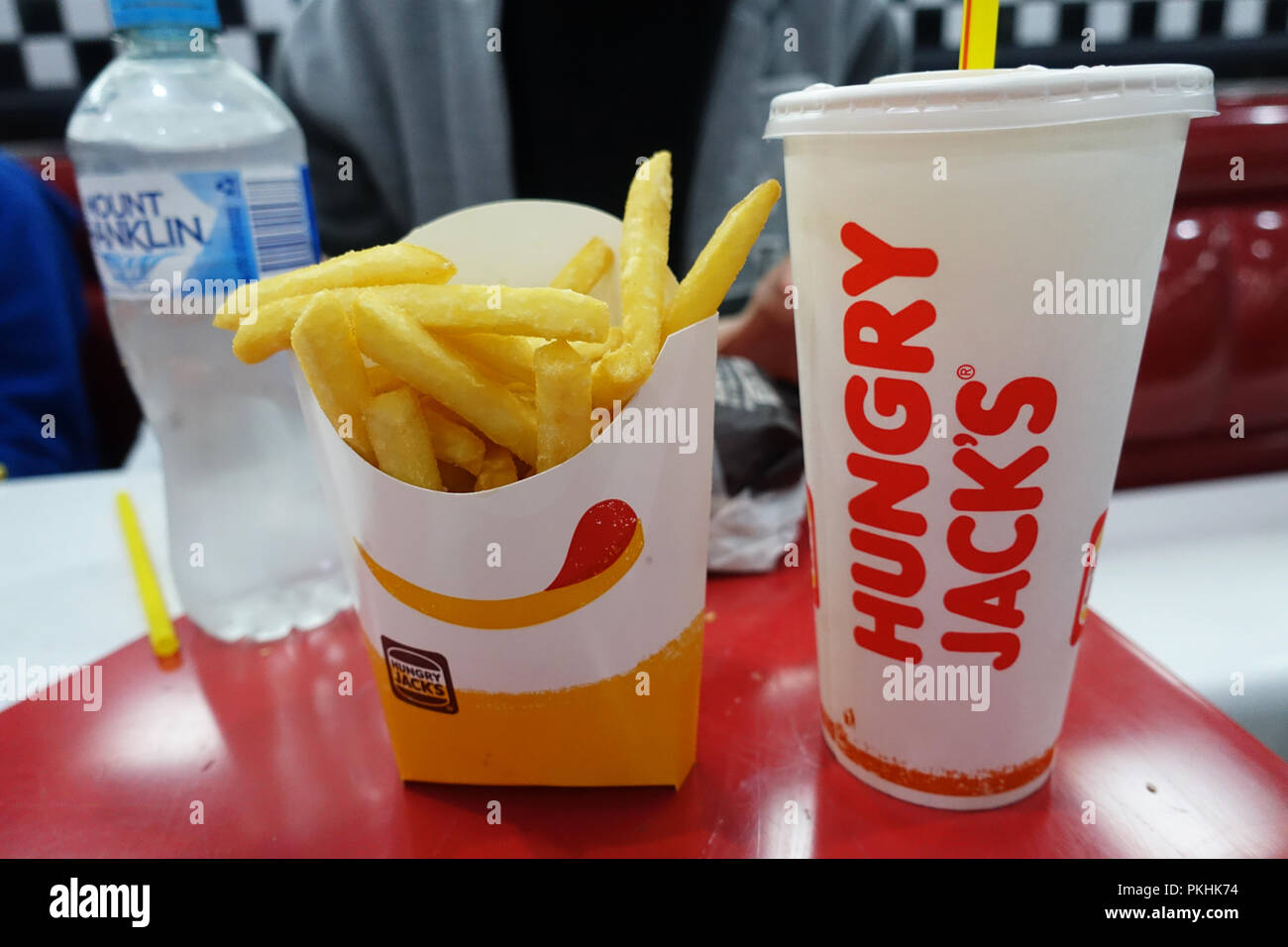 Australian fast food chain meal Hungry Jack's (Burger King) chips and a drink Stock Photo