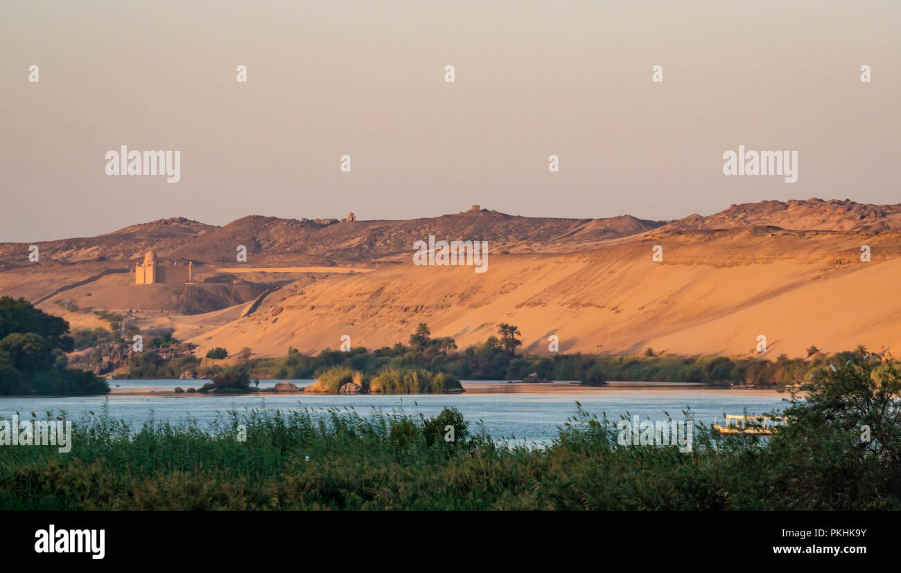 Aga Khan mausoleum and desert sand cliffs on West bank, Nile River, Aswan, Egypt, Africa Stock Photo