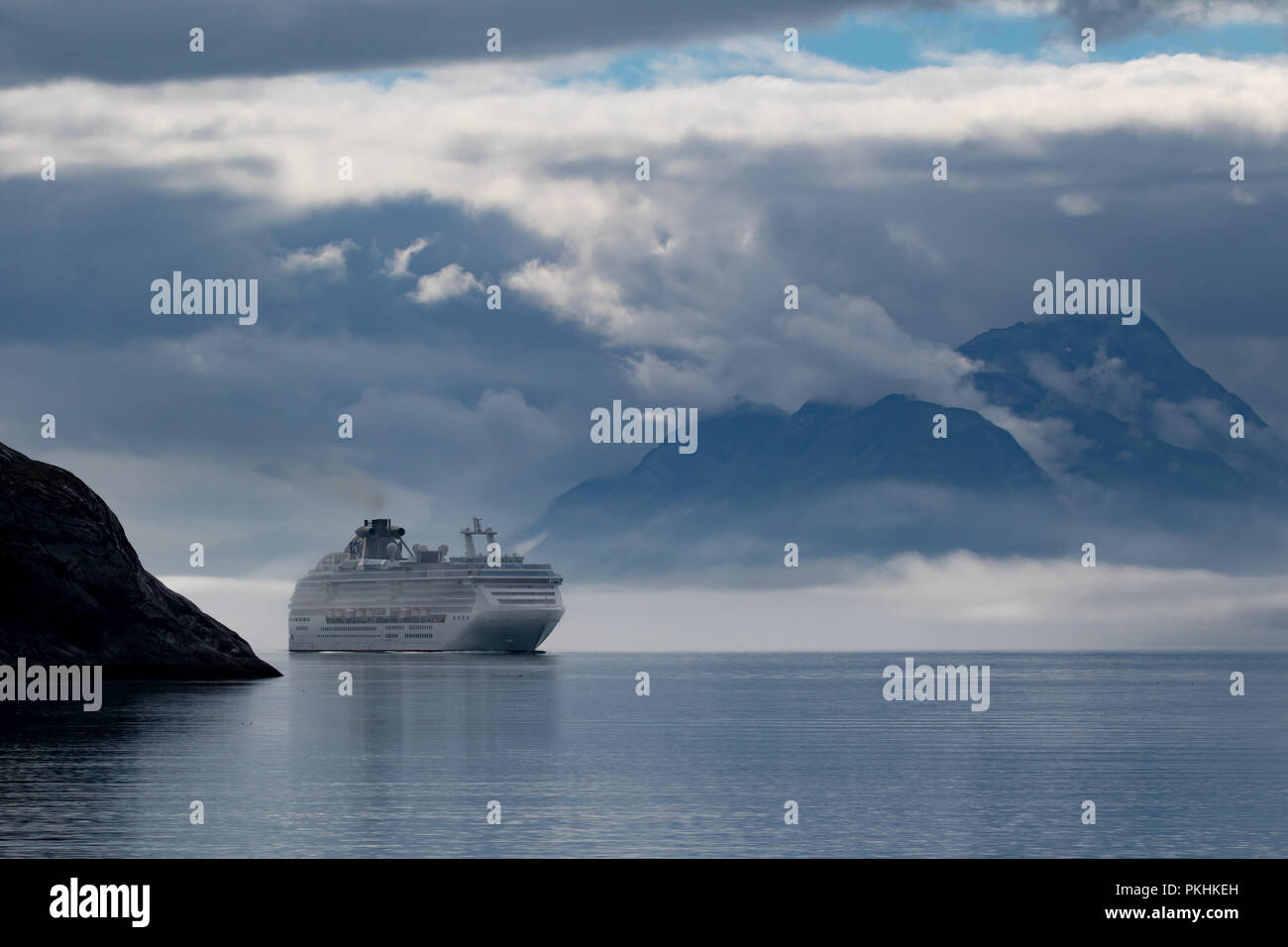 The cruise ship the Coral Princess of Princess cruise lines sails in Glacier Bay National Park in Alaska. Stock Photo