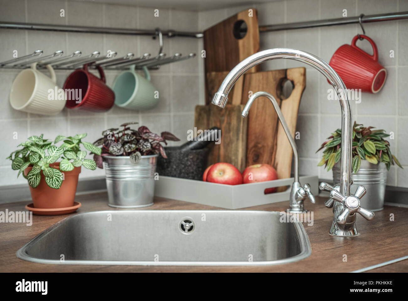 Interior of a modern domestic kitchen with water faucet closeup Stock Photo