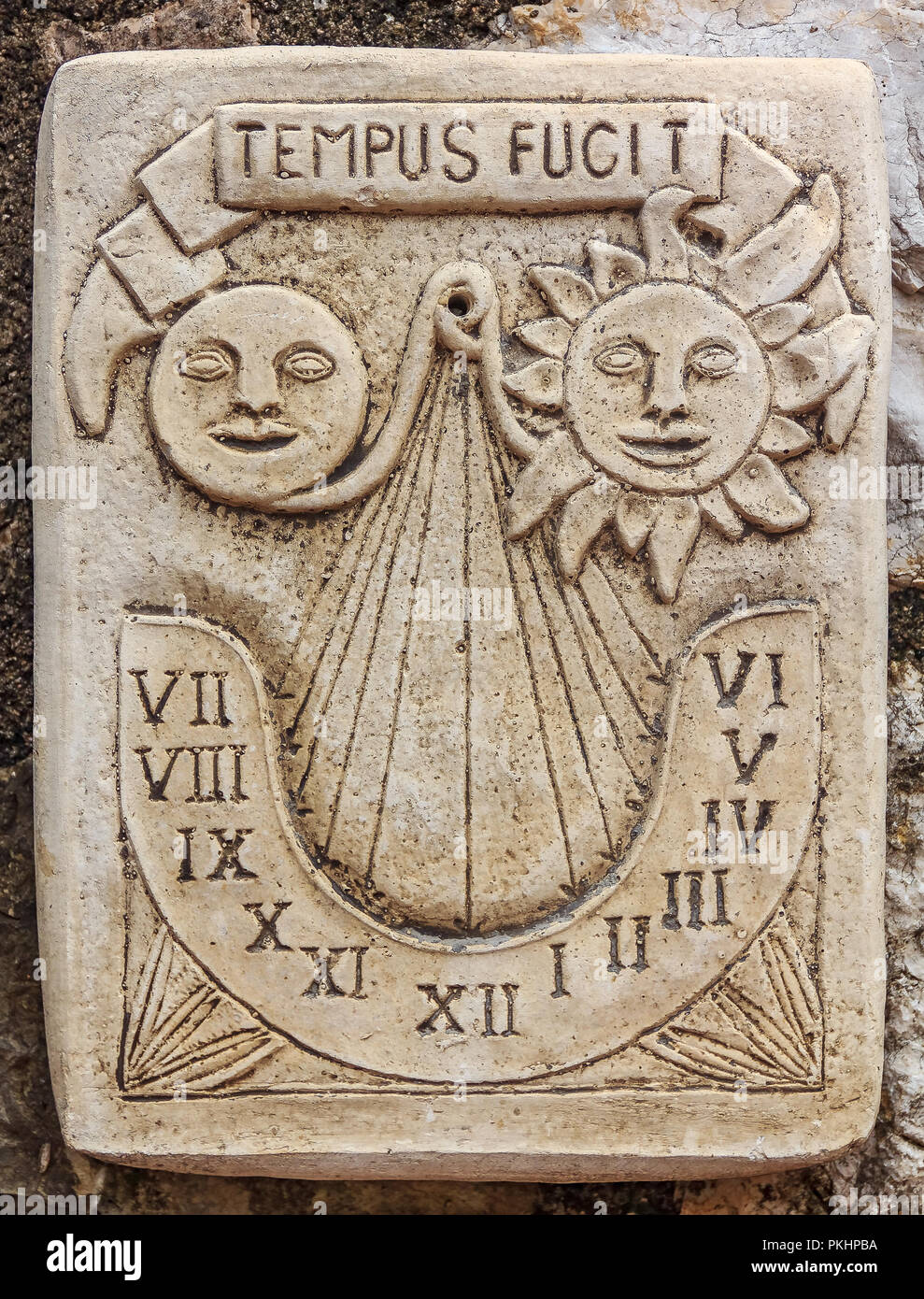 Antique marble sundial clock with a Latin inscription, meaning time