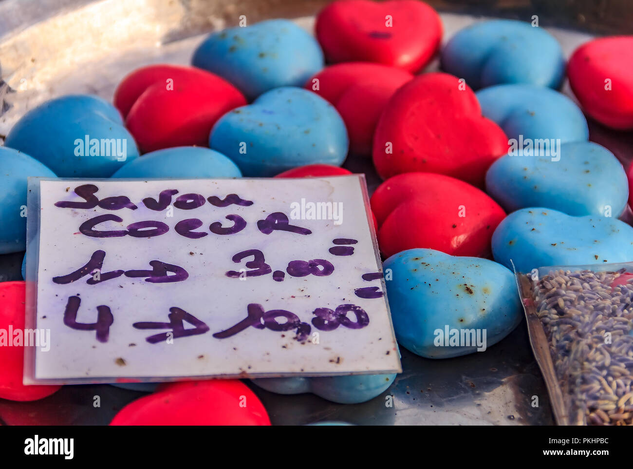 Colorful natural handmade French soap shaped like a heart at a market in a medieval city Eze Village, Provence, France Stock Photo