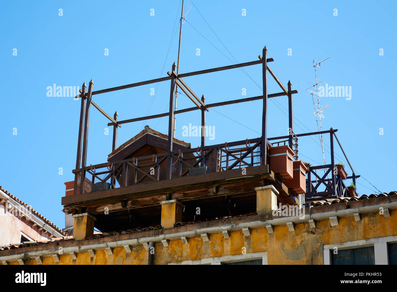 VENICE, ITALY - AUGUST 13, 2017: Typical altana wooden balcony on Venice roof in a sunny summer day in Italy Stock Photo