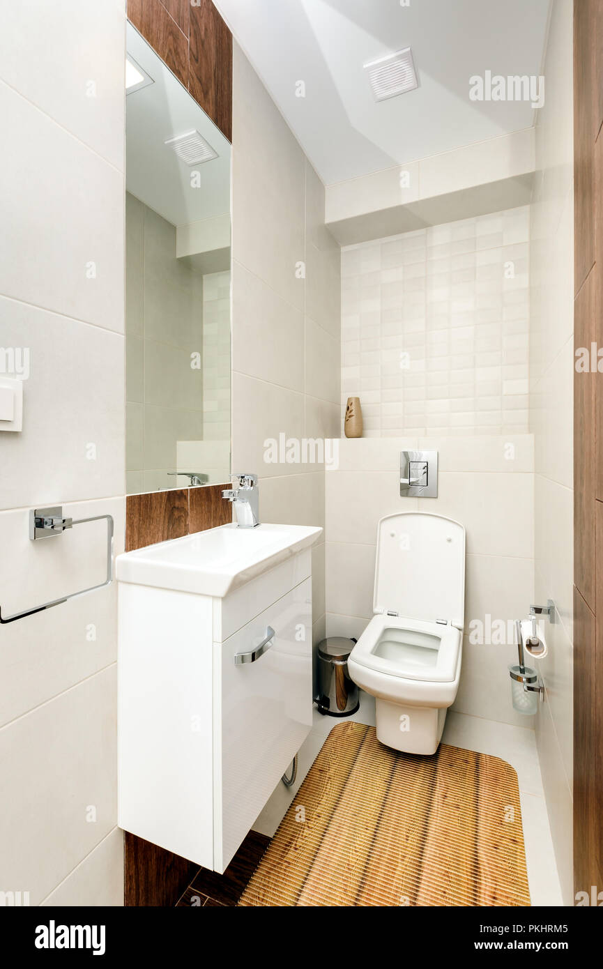 Modern white and beige bathroom interior Stock Photo - Alamy