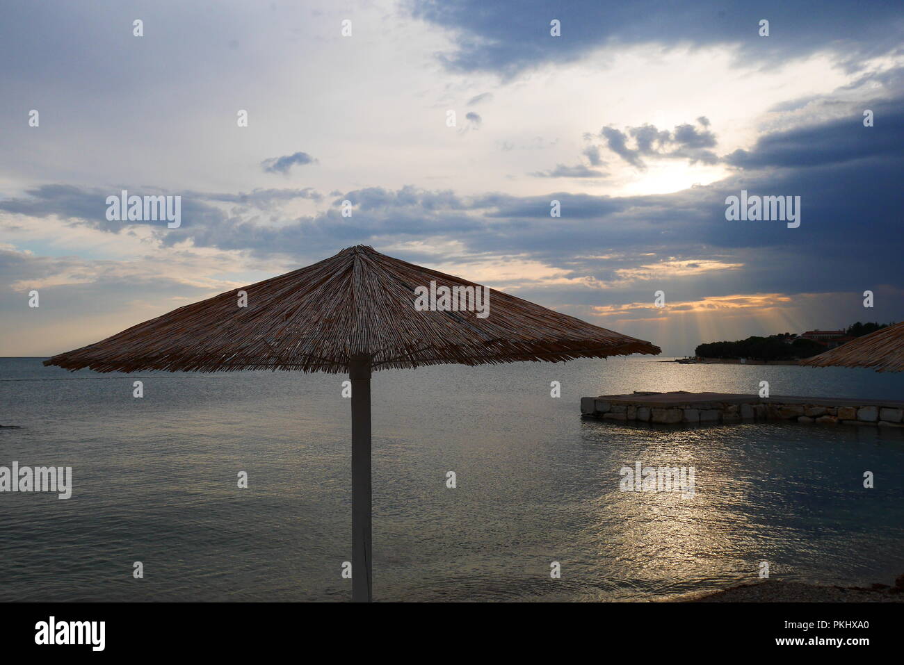 Beach Umbrella at a beach in novigrad, croatia Stock Photo Alamy