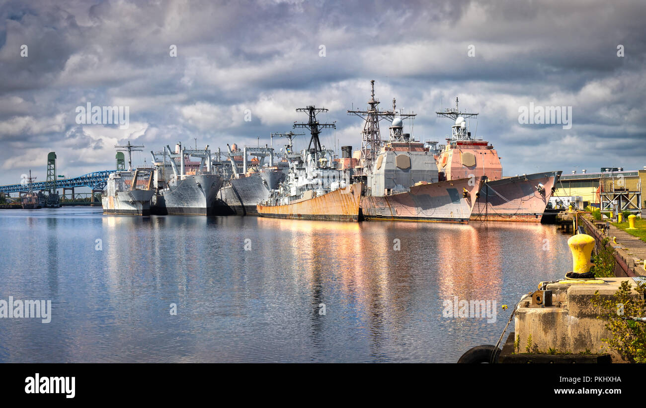 Decommissioned Navy ships, sometimes called the "mothball fleet", at an east coast port. Stock Photo