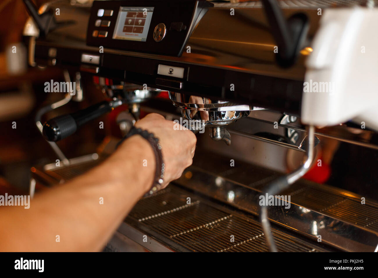Barista preparing espresso, coffee making process Stock Photo Alamy