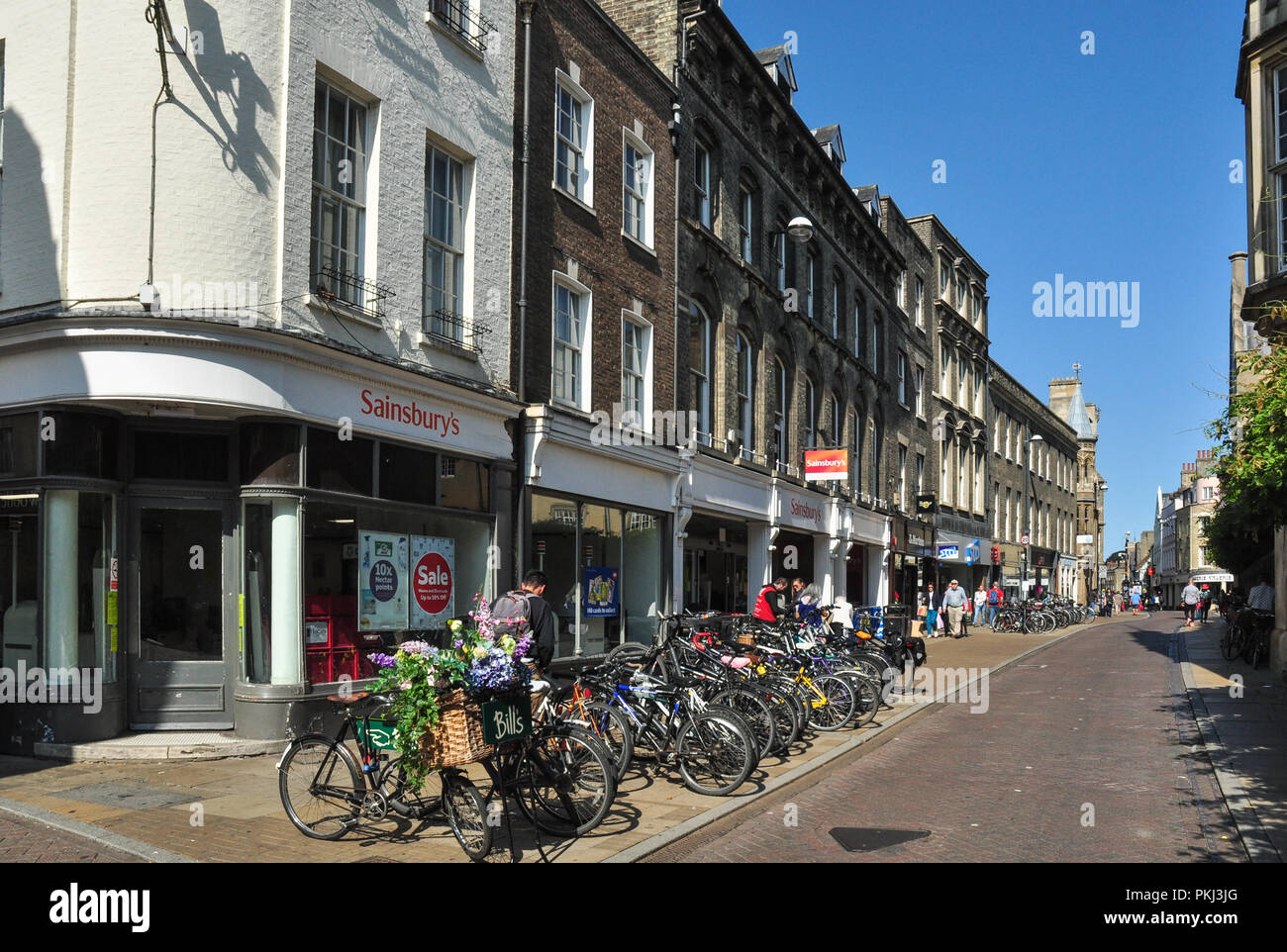 Bicycles, shops and offices, Sidney Street, Cambridge, England, UK Stock Photo