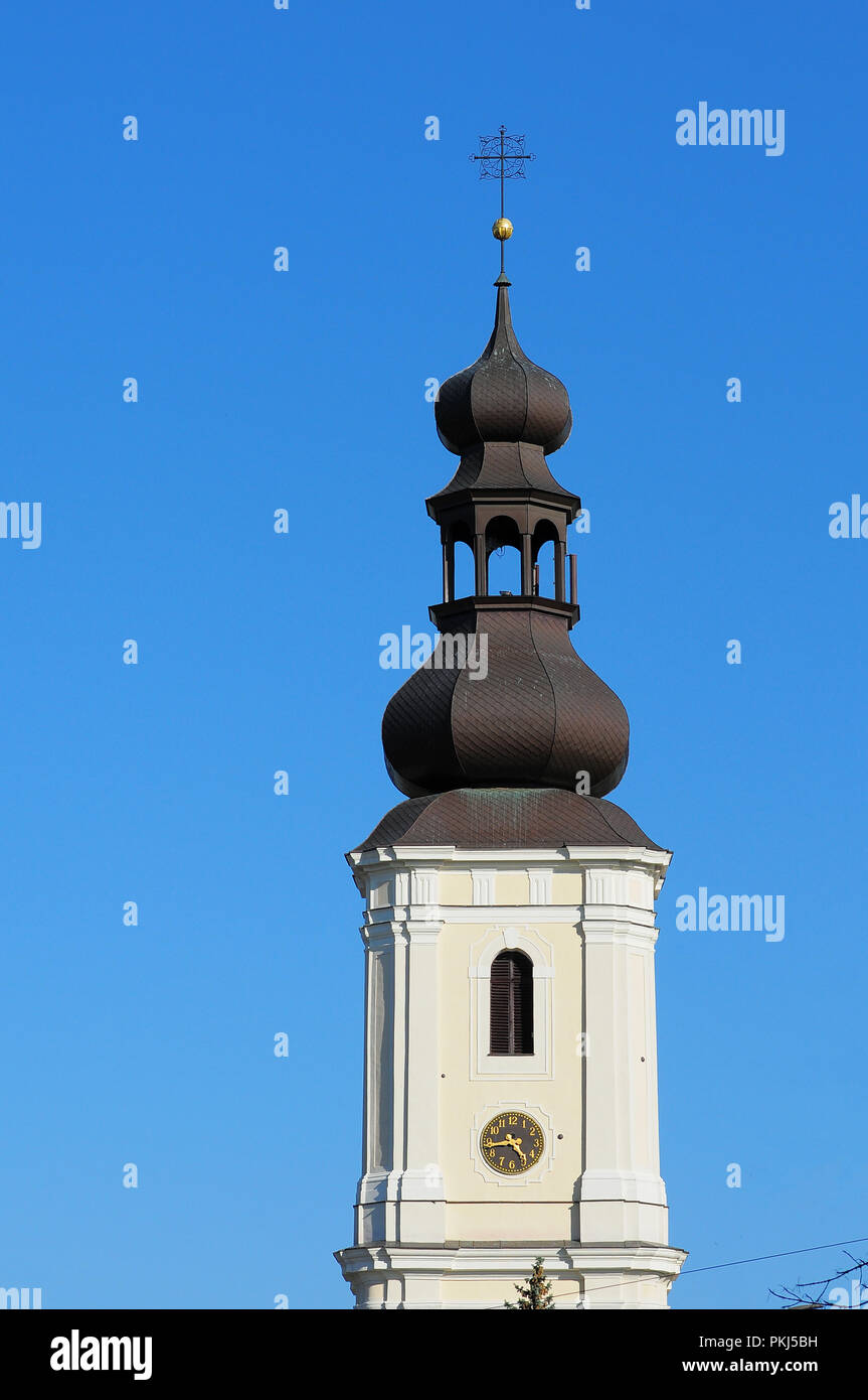 Old Polish catholic church (Church of Sts. Maurice) tower with clock on the clear blue sky. Wroclaw, Poland Stock Photo