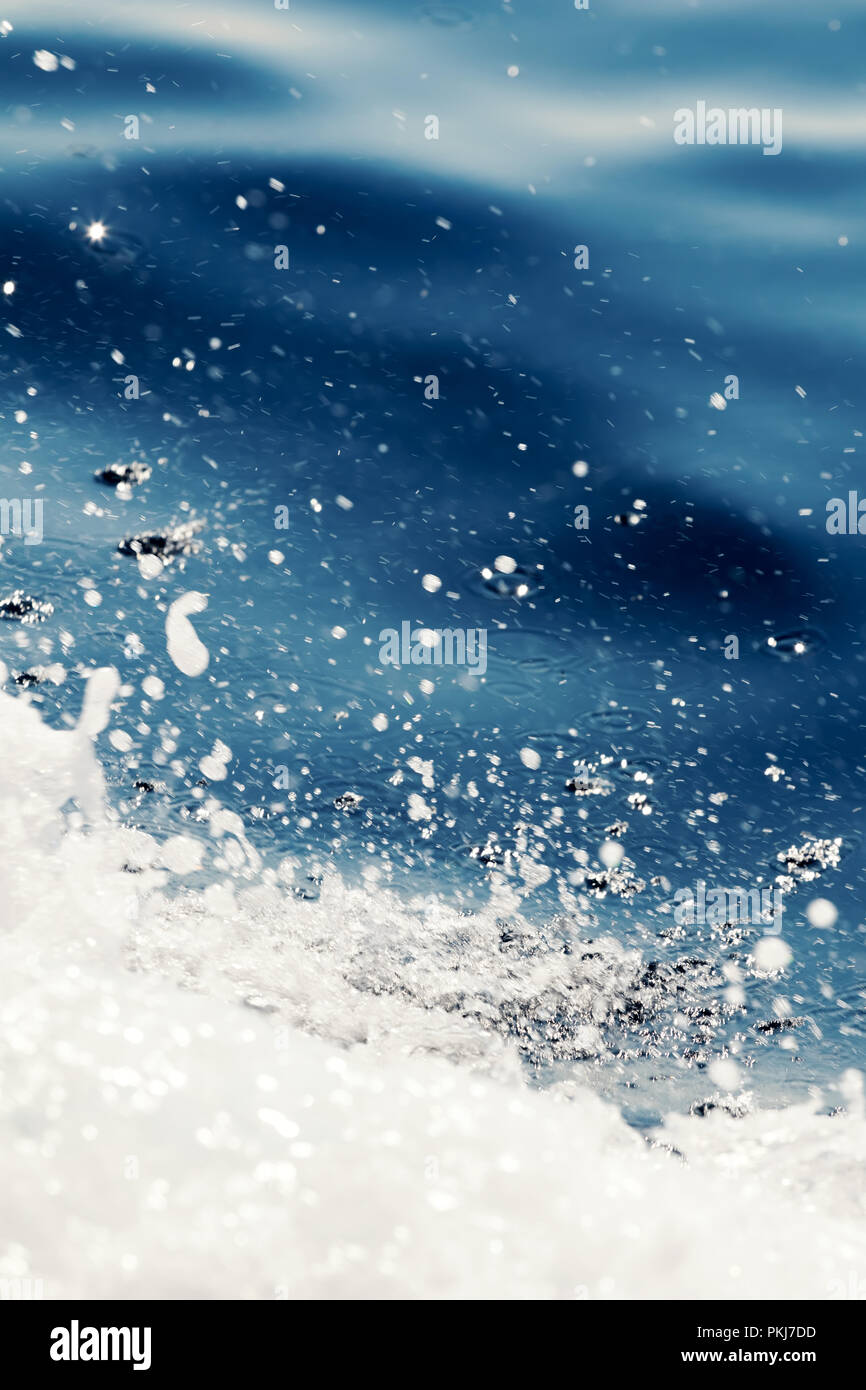 Ocean wave surface, crashing wave with foam on its top Stock Photo