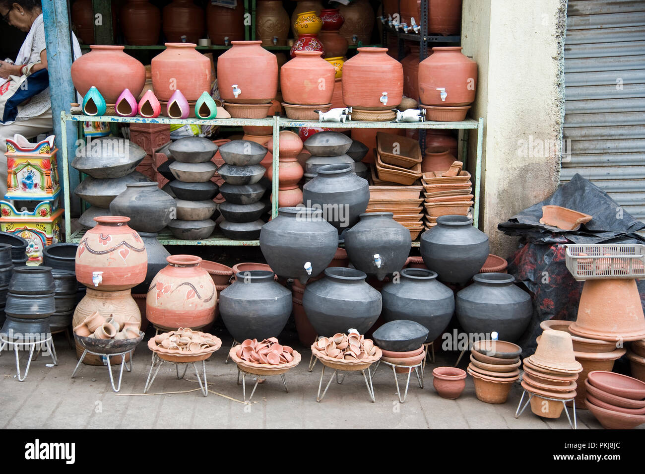 Hawkers sell earthen pots or Drinking clay pot pottery shop at nashik  maharashtra India Stock Photo