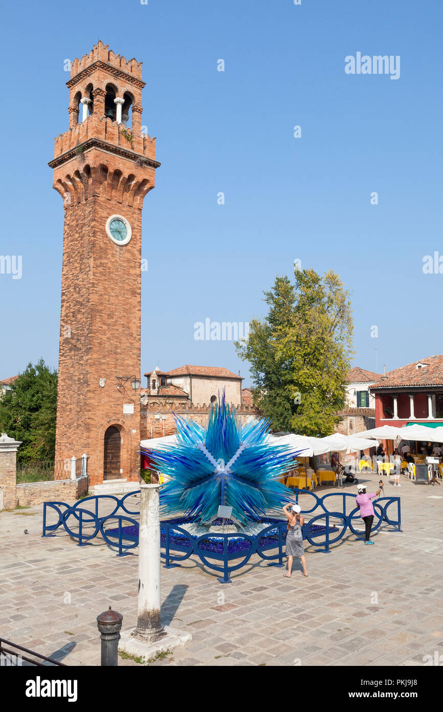 Campo Santo Stefano, Murano, Venice, Veneto, Italy with the blue Murano glass Cometa di Vetro by Simone Cenedese. Tourists taking selfies, people at r Stock Photo