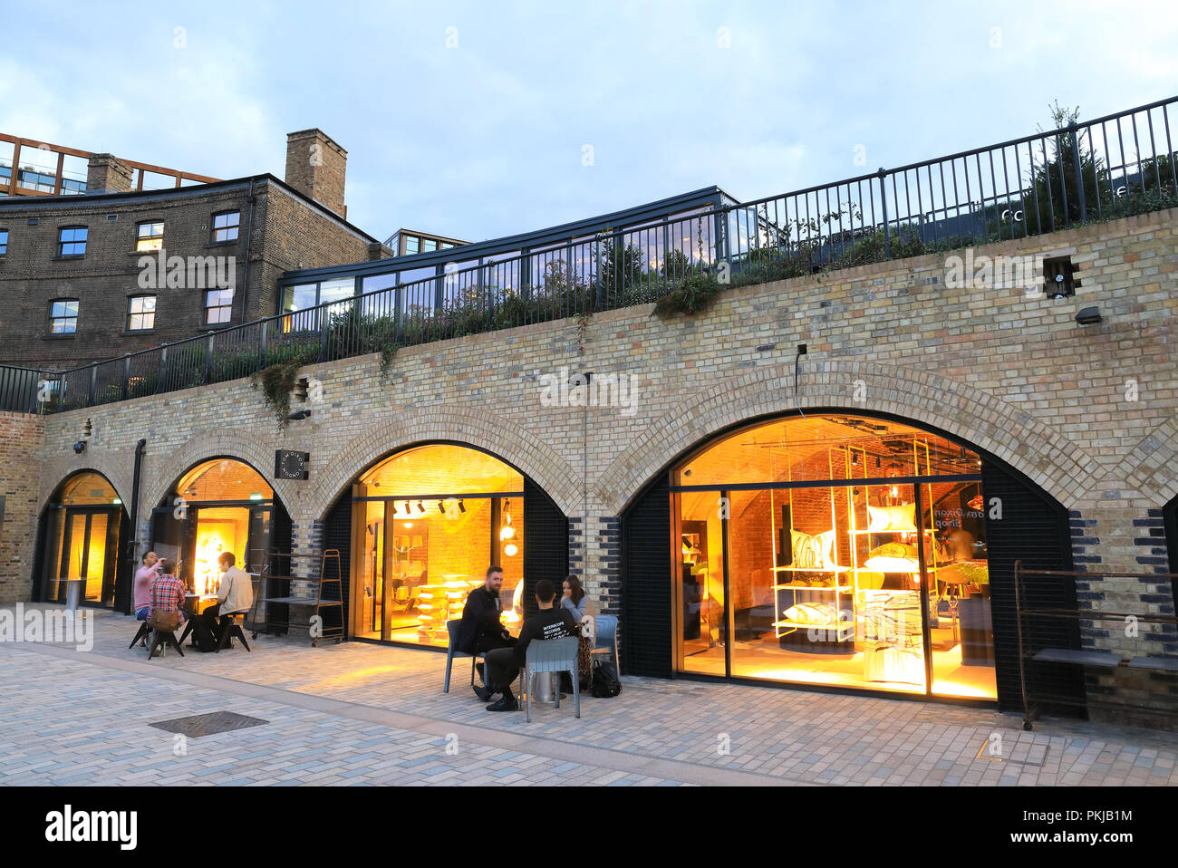 The stylish Tom Dixon showrooms on Bagley Walk, in historical converted  brick archways in Coal Drops Yard at Kings Cross, in north London, UK Stock  Photo - Alamy