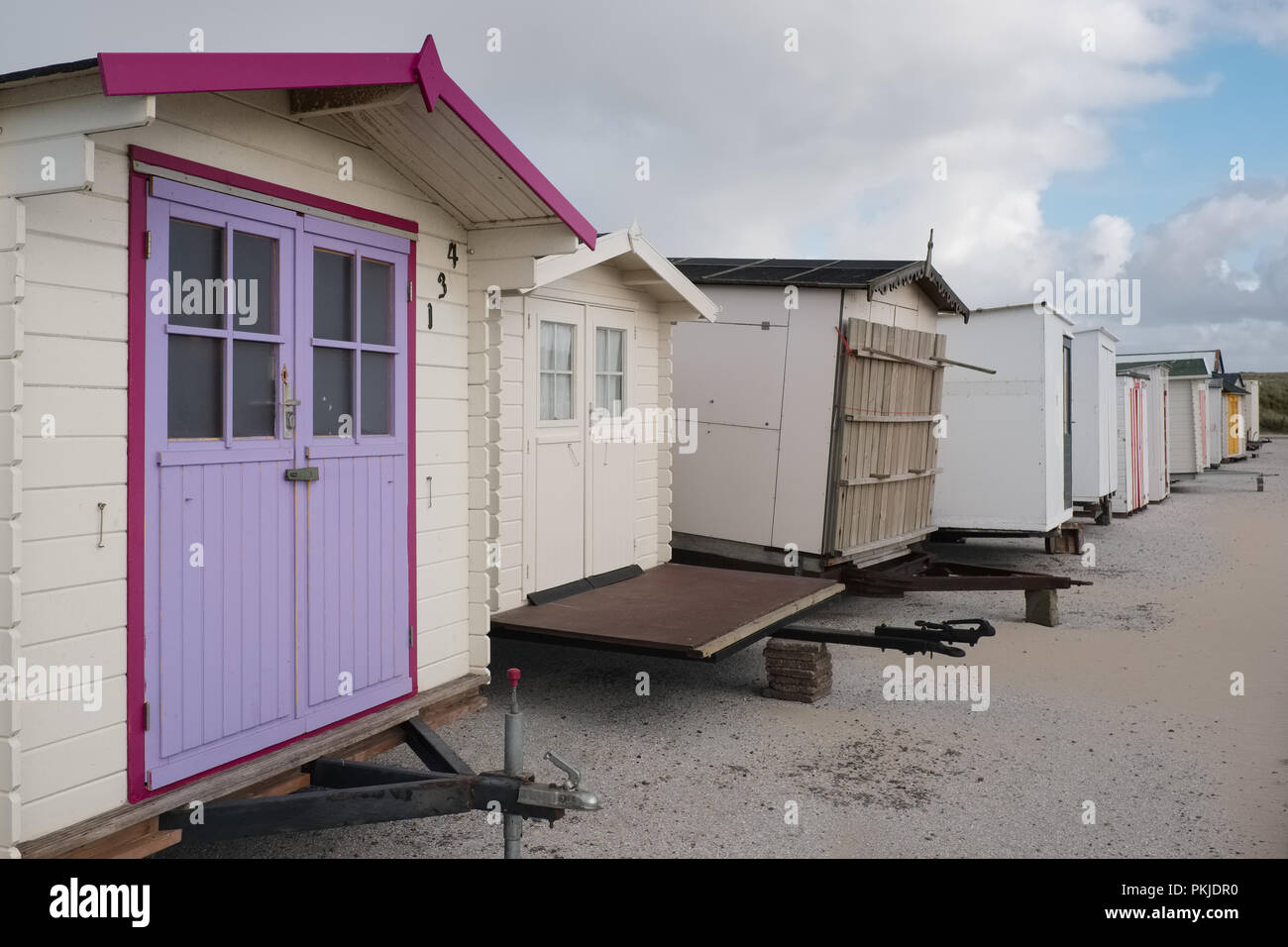 Beach houses lined up waiting for summer, Saturday 14 May 2016, Texel, the Netherlands. Stock Photo