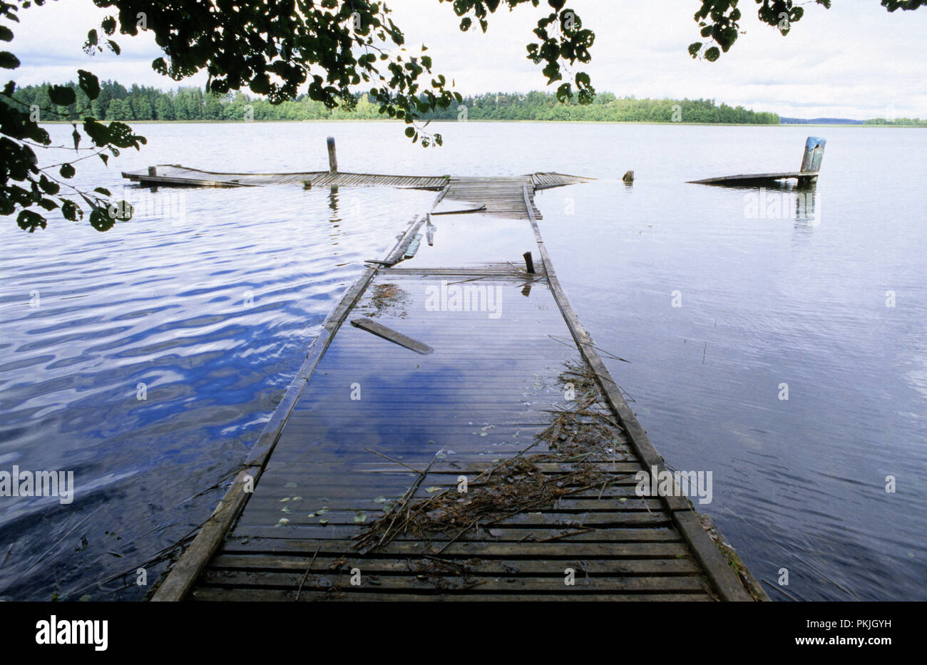 Dilapidated wooden jetty on Lake Wigry in the Suwalszczyzna region of Poland August 2007 Stock Photo