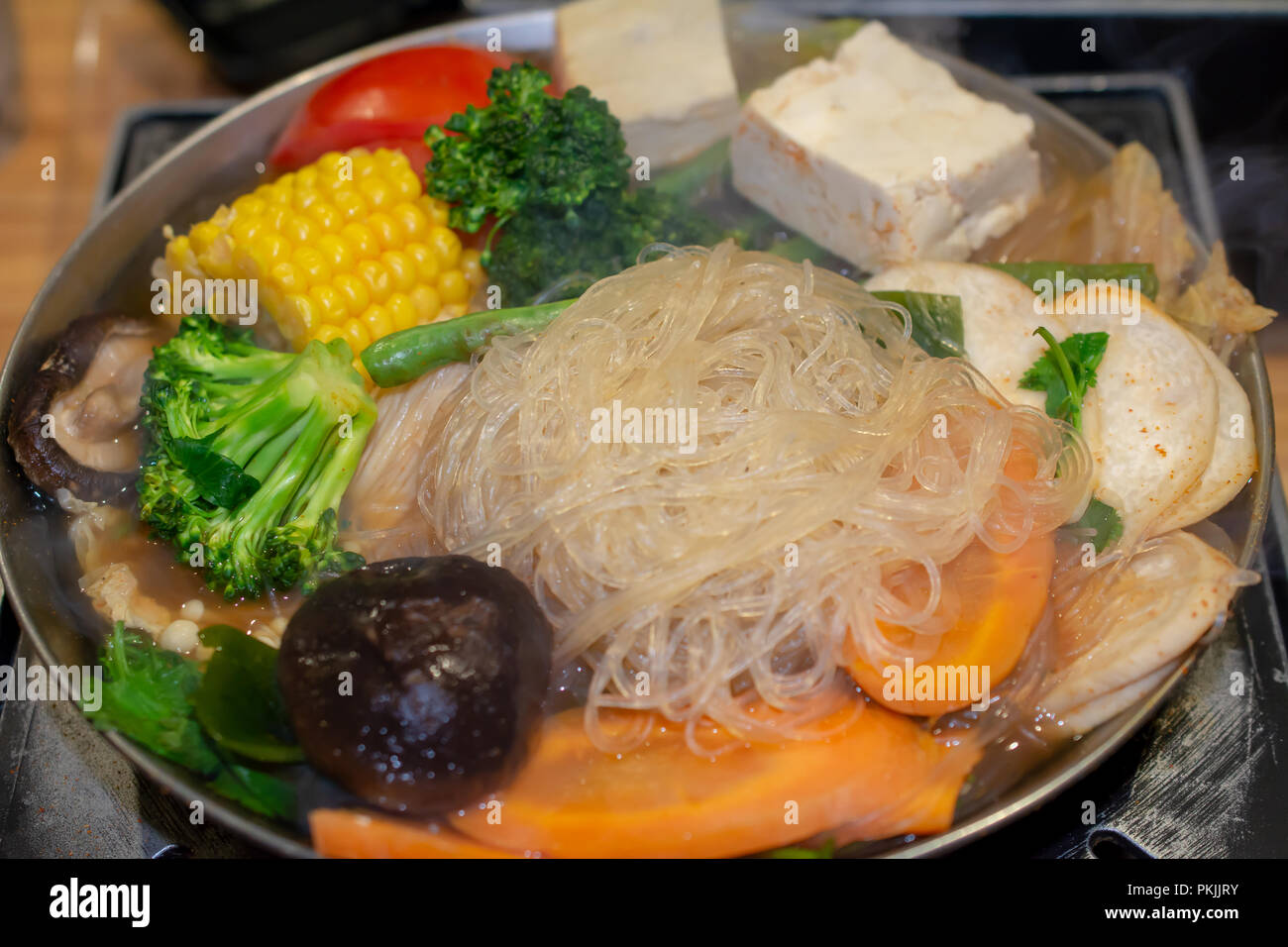 Selective focus on rice noodles of Tawanese vegetarian boiling pot