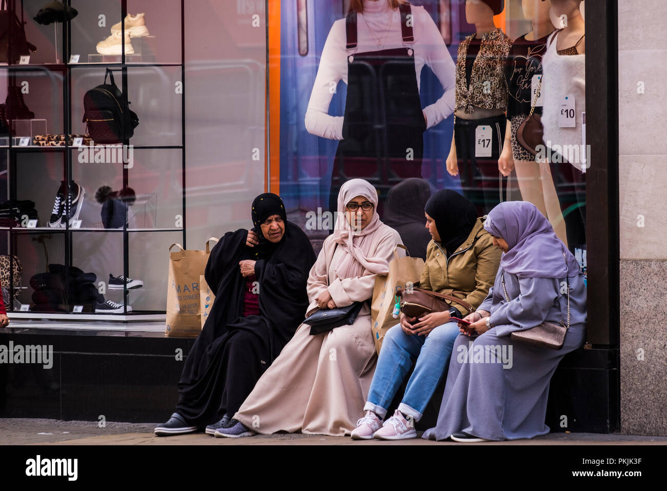 Muslim women shopping on Oxford Street, London, England, U.K. Stock Photo
