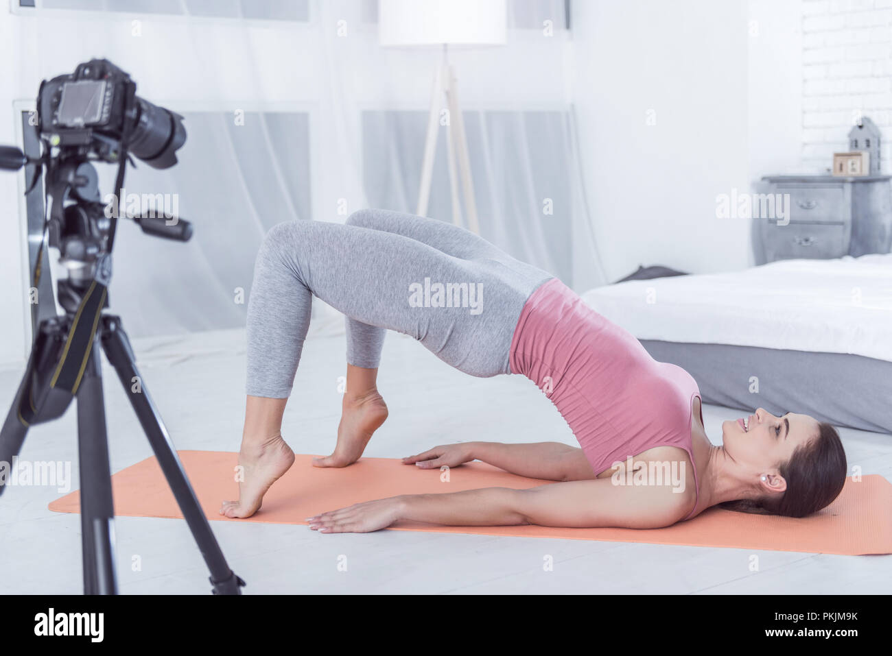 Delighted pleasant woman enjoying her sports workout Stock Photo