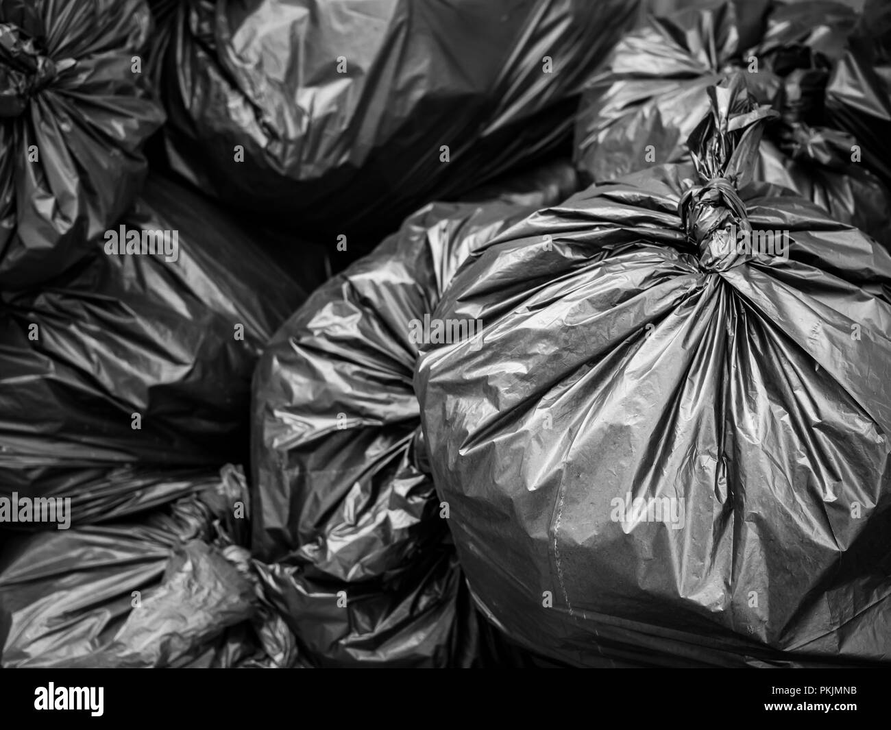 Garbage black bag background. Pile of black bin bag for gabage, Trash