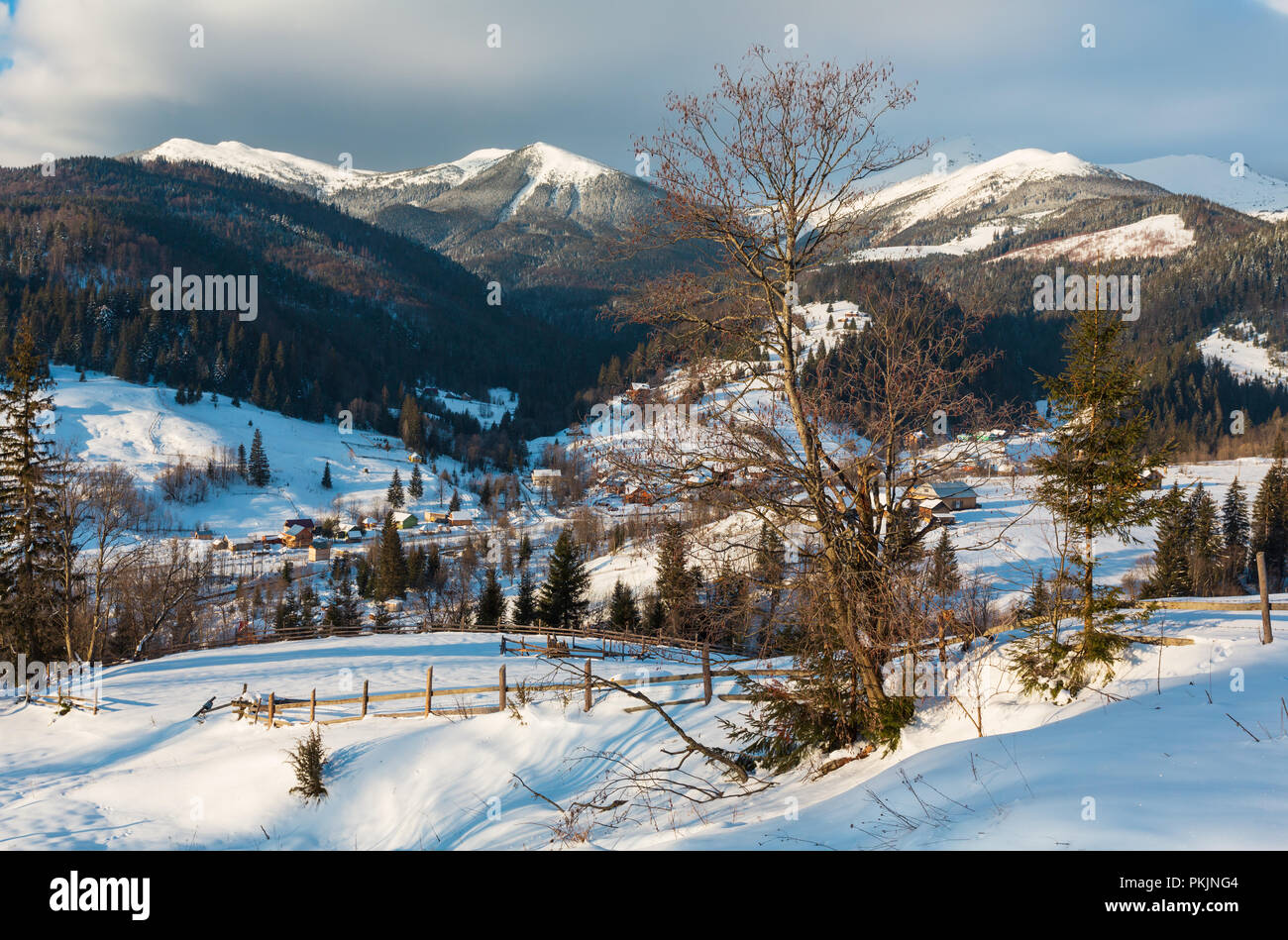 Winter  morning scenery tranquility peaceful  mountain Dzembronya village outskirts hills and view to picturesque Chornohora alp ridge (Ukraine) Stock Photo