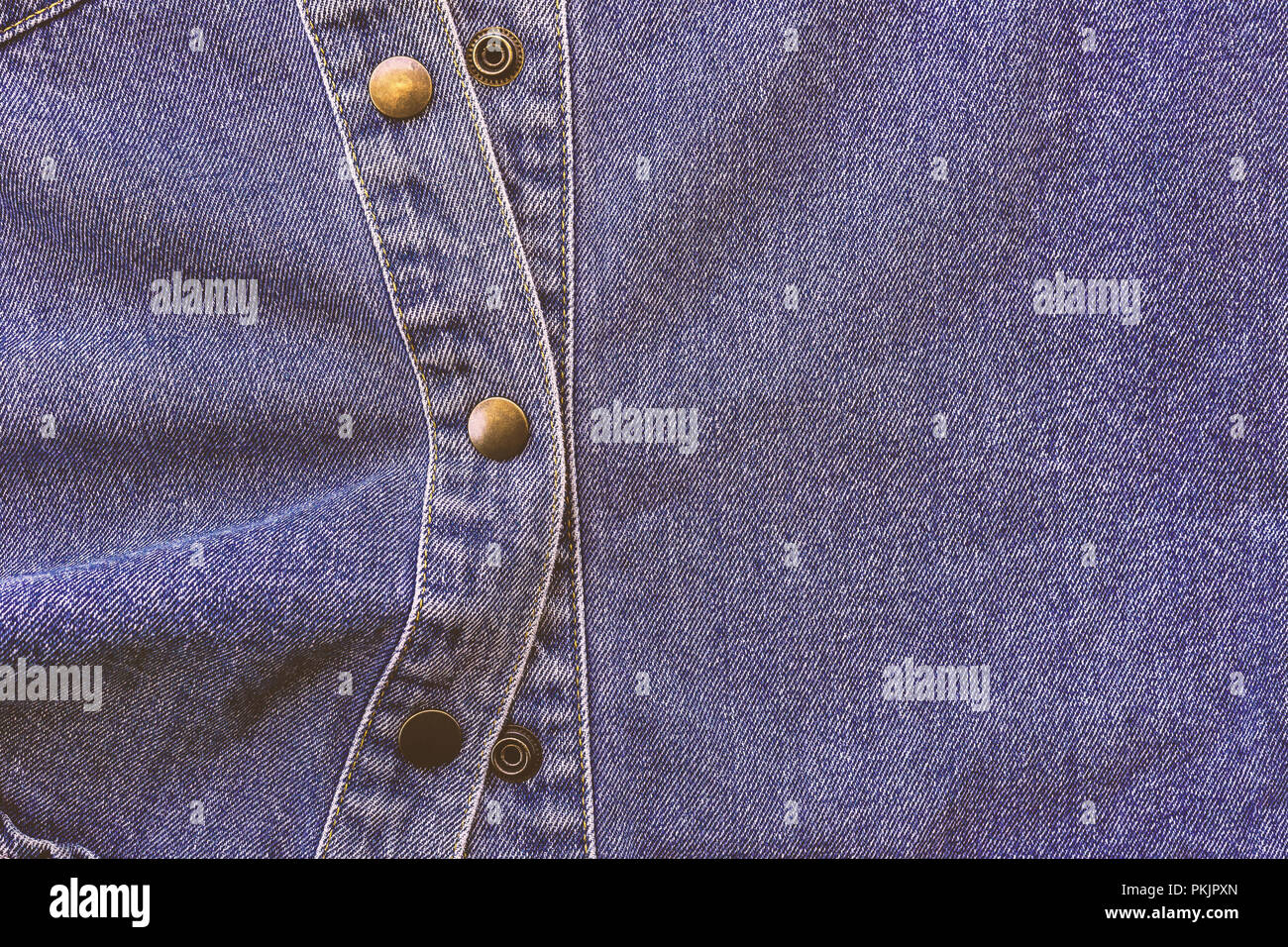 Denim and Metal Button. The intention is to be the backdrop and film tone color. Stock Photo