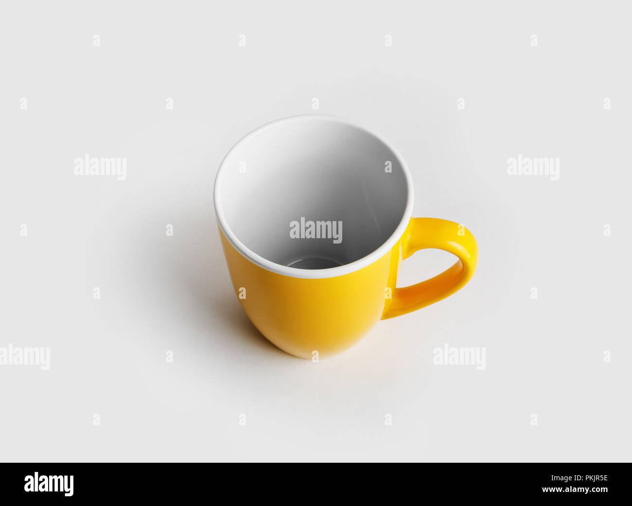 Yellow ceramic cup or mug for coffee or tea. Stock Photo